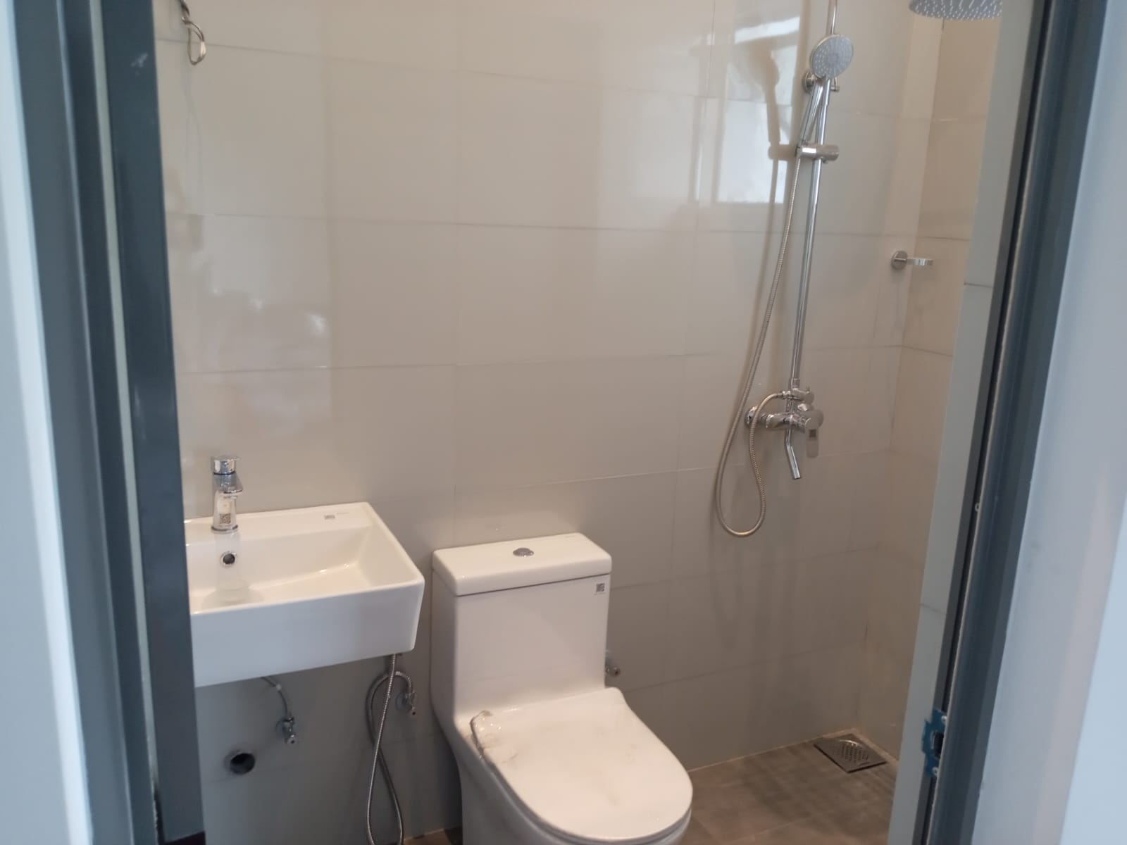 Modern en-suite bathroom with rain shower and premium fittings