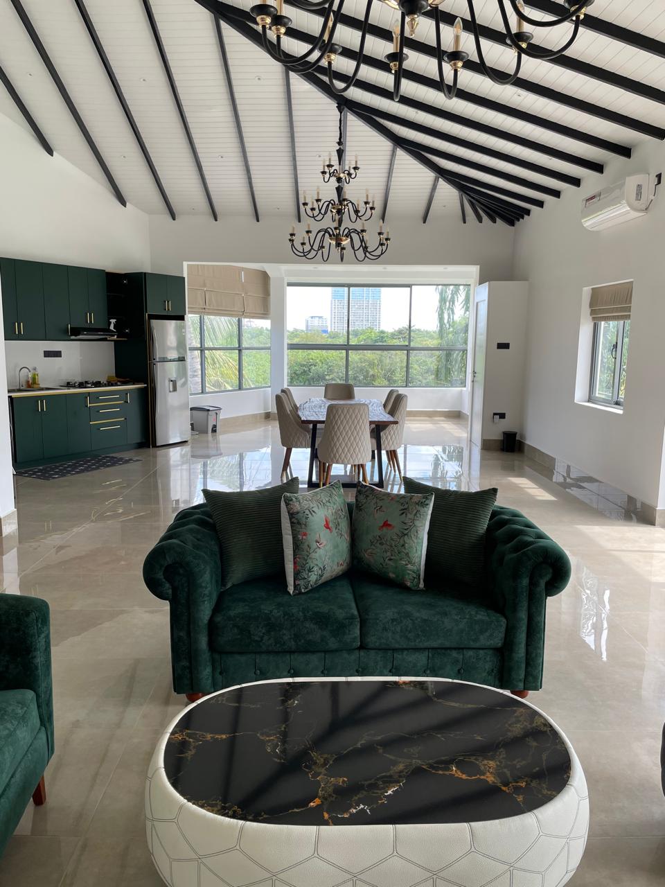 Open-plan living area looking through to the kitchen and conservatory dining space