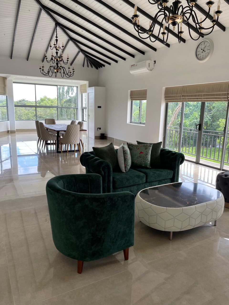 Open-plan living area looking through to the kitchen and conservatory dining space