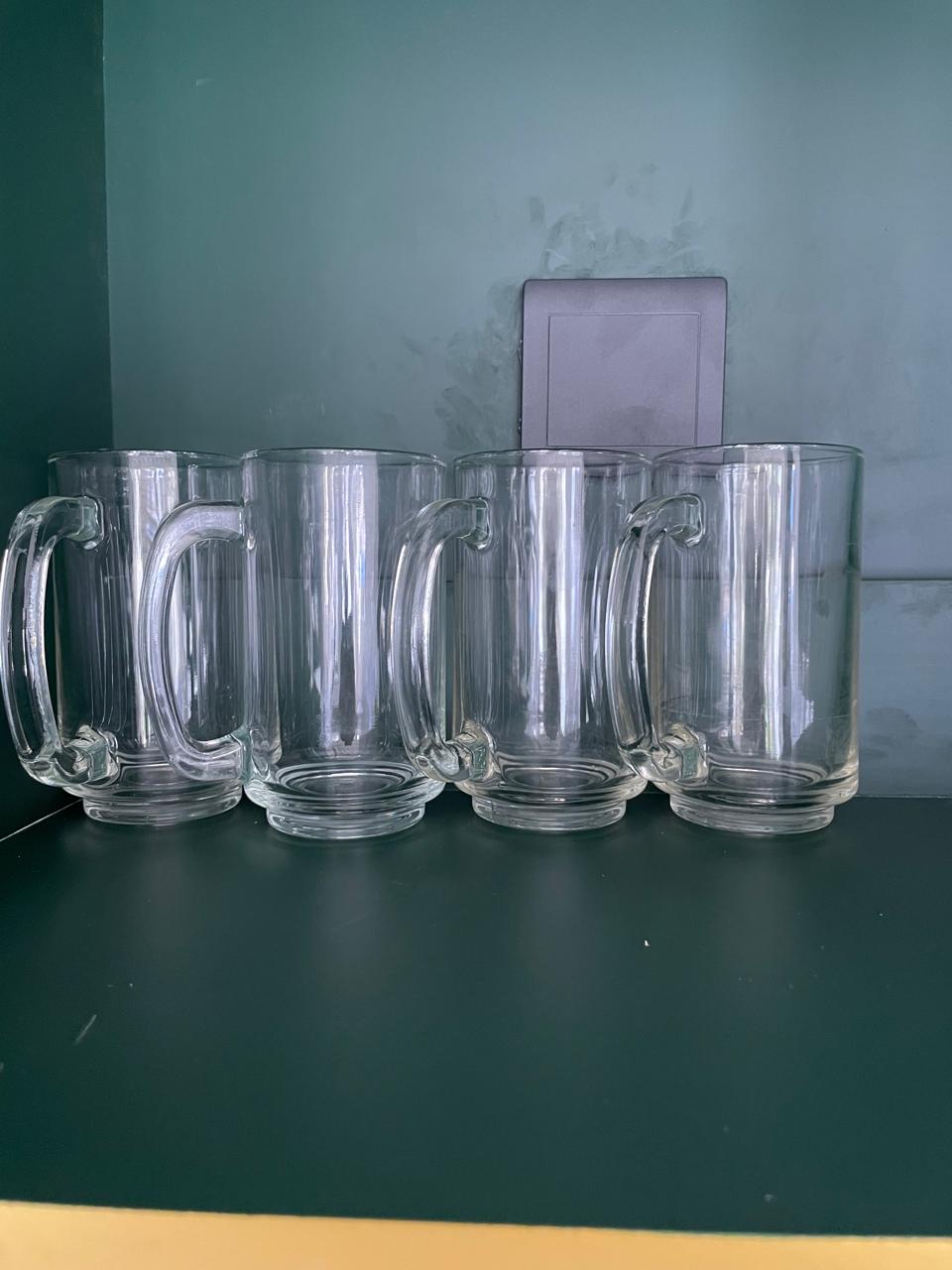 Set of four clear glass tankards